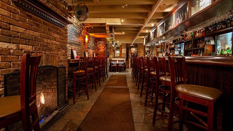 View of bar seating area with fireplace