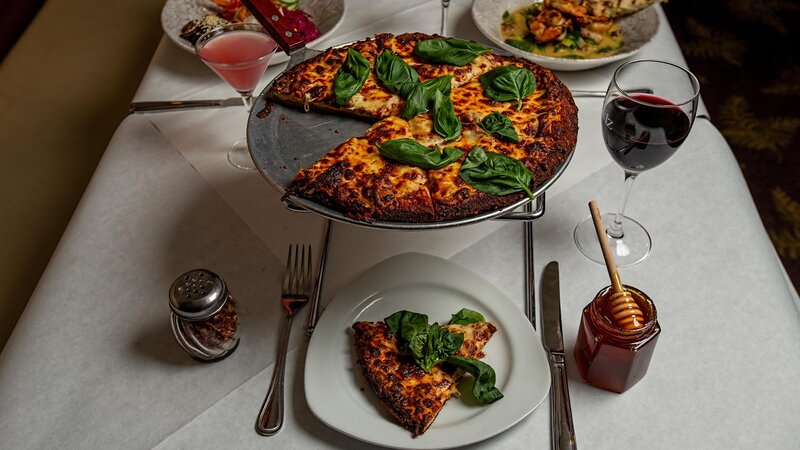 Pizza topped with arugula