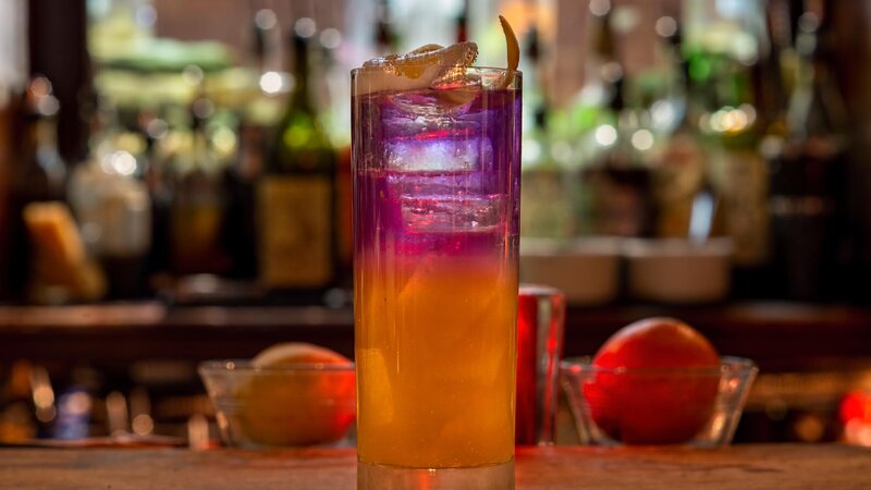 Pink and orange cocktail on the bar top