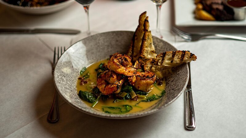 Grilled shrimp entree with side of ciabatta bread